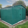 The 10ft x 10ft steel garden shed from Sheds Direct Ireland. It is a green, steel shed with vertical panels. The doors are closed, there is a metal frame around the edge at the bottom and there is grass in the foreground of the scene and blue skies above the shed