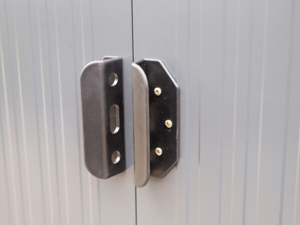 The sliding door handles on the steel shed