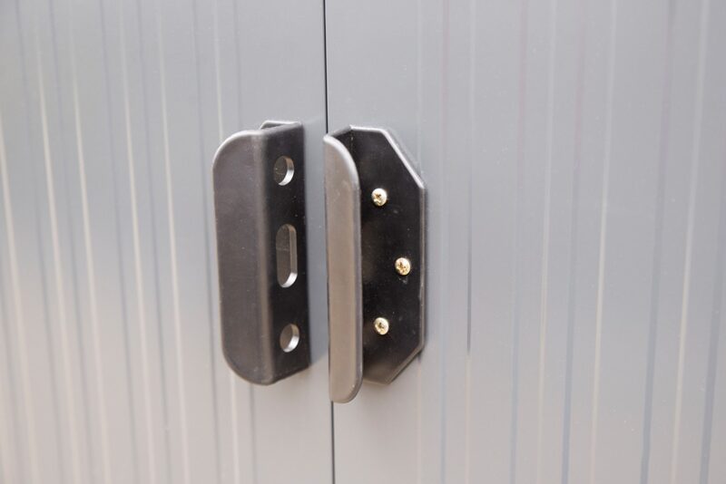 The sliding door handles on the steel shed