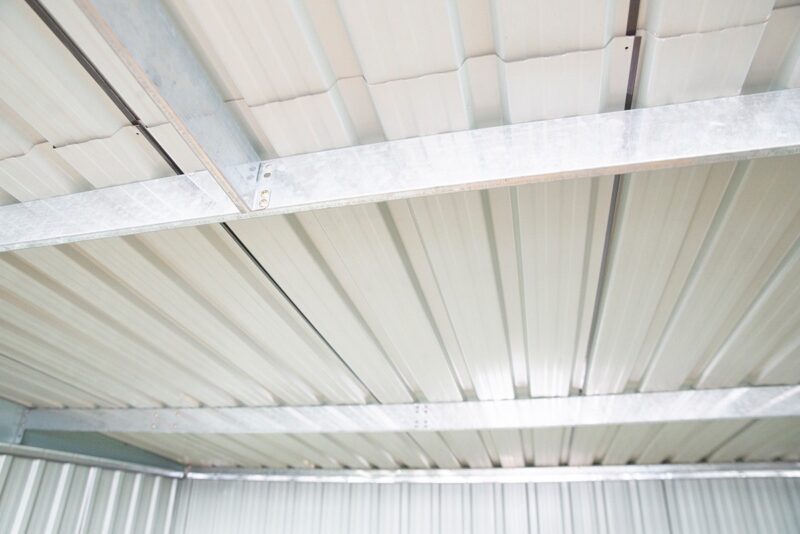 The roof support inside the shed. iT IS TWO LARGE, HORIZONTAL BARS.