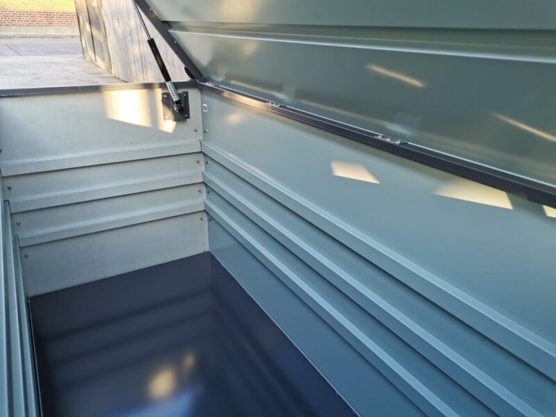 The inside of the 400L Garden Storage Box from Sheds Direct Ireland. It is grey with a three-striped interior design