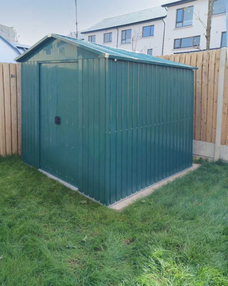 The green 6ft x 9ft steel shed in a garden