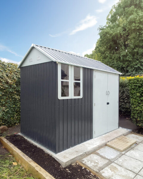 The steel cottage shed on a concrete slab in an enclosed garden in Galway