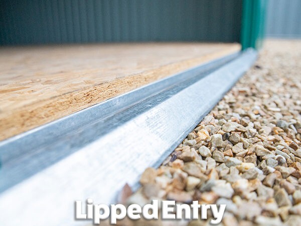 A low angle view of the lipped, metal entry to the Colossus Shed