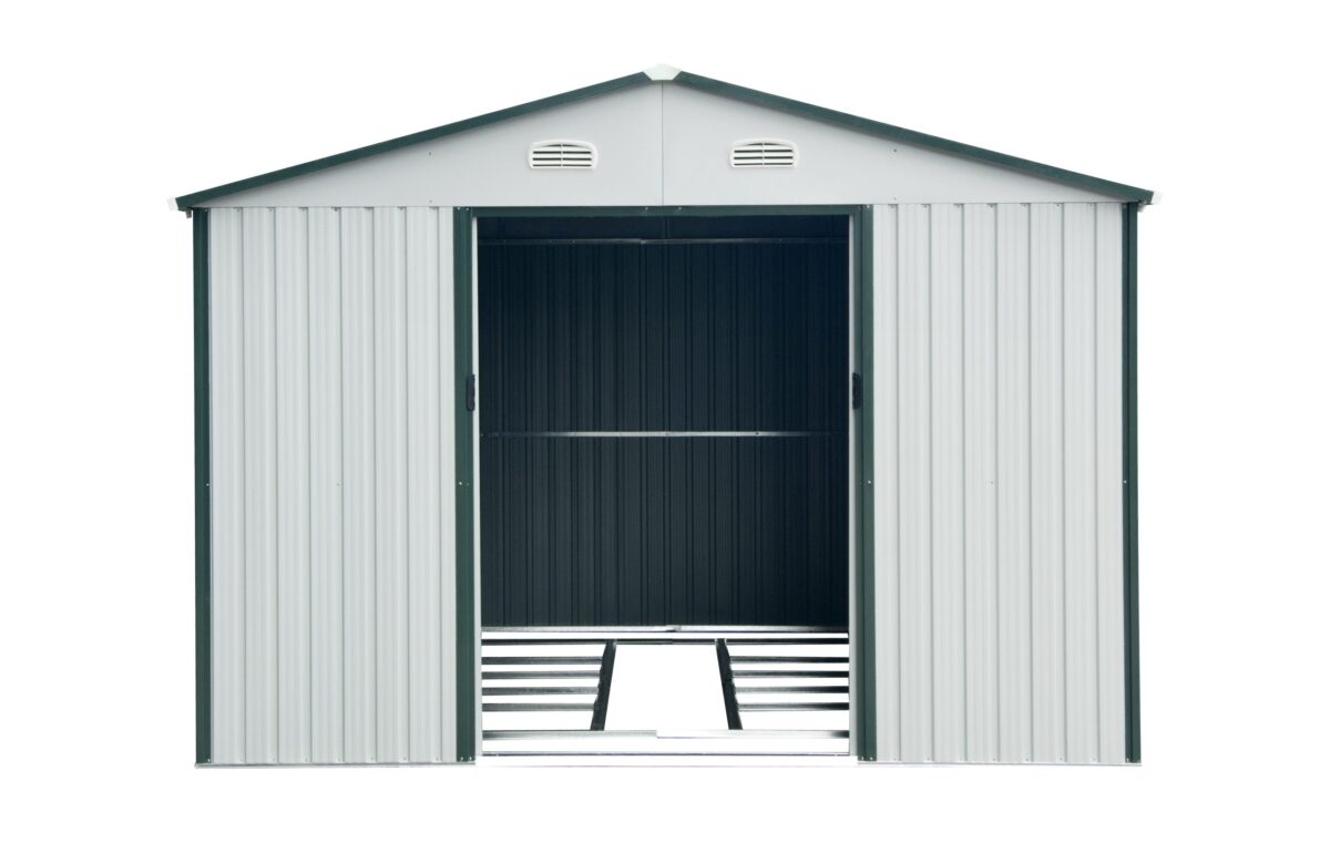 A picture of the white-grey 10ft x 12ft steel shed as seend from the front, with the door open from Sheds Direct Ireland. The shed is against a white background and has green edges on the frame, apex and doors. The doors are sliding and there are 2 vents visible above the door in the photo.