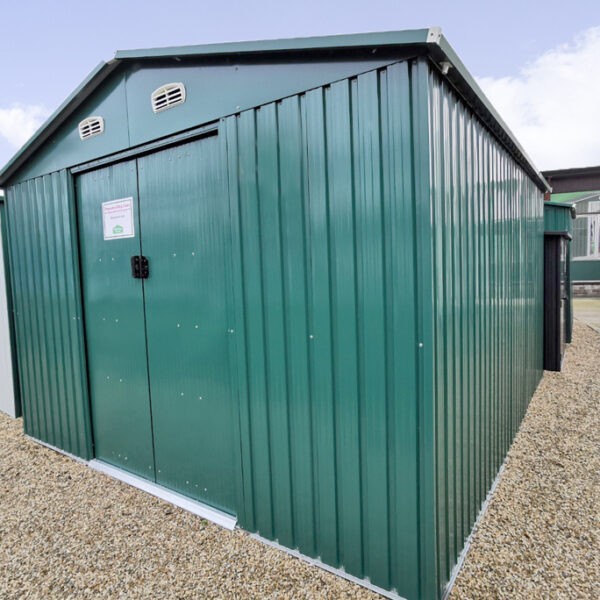 The green colossus shed as seen on the Sheds Direct Ireland showroom lot. It's seen from a low angle and it's a dark shade of green.