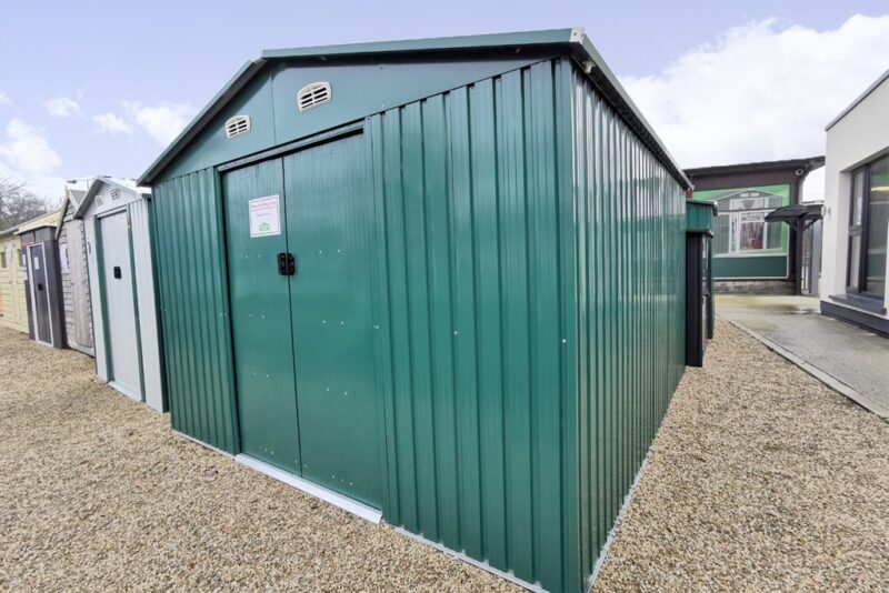 The green colossus shed as seen on the Sheds Direct Ireland showroom lot. It's seen from a low angle and it's a dark shade of green.