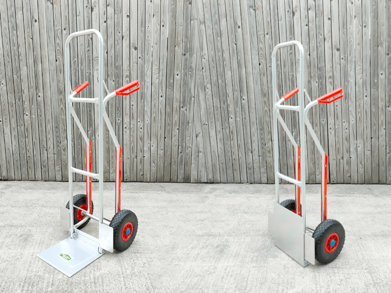 Two of the aluminium hand trucks side by side - one has the plate open and the other has it closed.