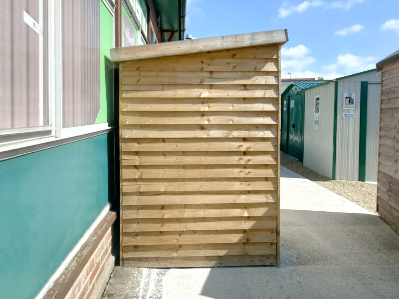 The side profile of the wooden bike shed