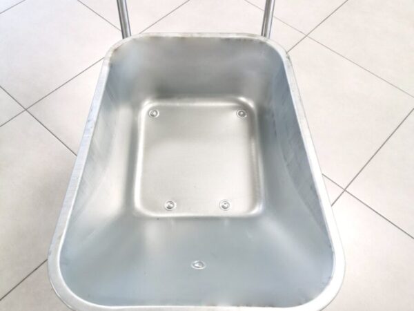 An above view of the Steel Wheelbarrow. The barrow is polished grey steel and the wheels and rubber hand guards are matching black.