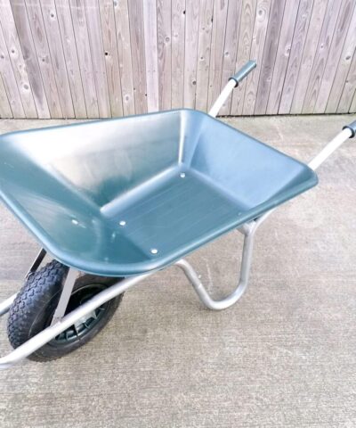 The 100L dark green wheelbarrow as seen from above. It has a silver frame and black, thick wheel