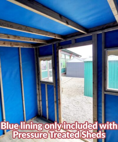 The inside of a wooden cabin. It is lined with blue felt and there are wooden joysts there for support.