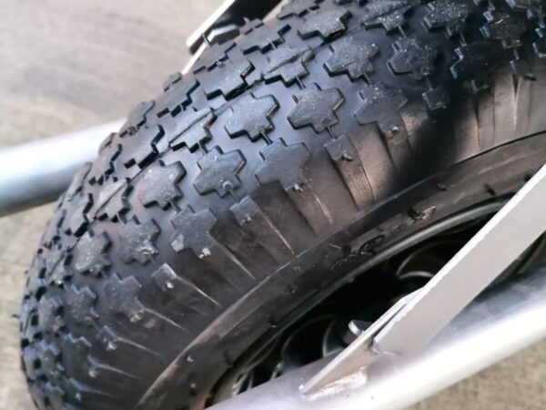 Macro details of the tyre on the Sheds Direct Ireland 100L Wheelbarrow