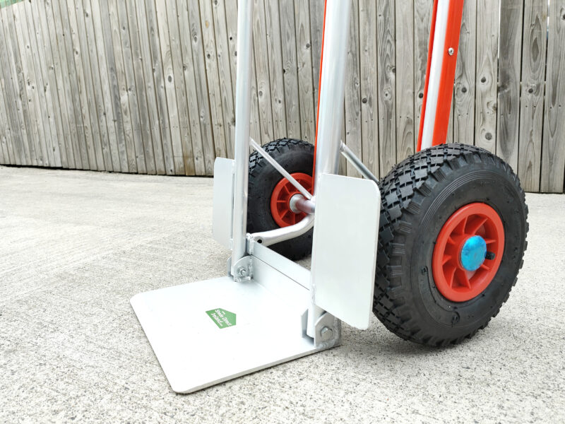 The side view of the hand truck with fold down footplate