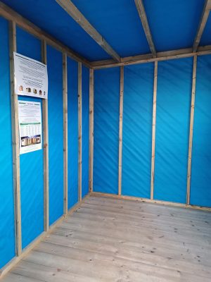 The internal membrane lining of the cabin shed. It is a bright, royal blue.