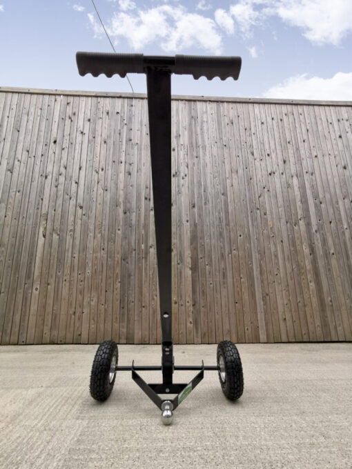 A low view of the trailer dolly, which has the full unit in frame. The sky is in frame above and the unit forms a large 'T' shape, with wheels at the bottom