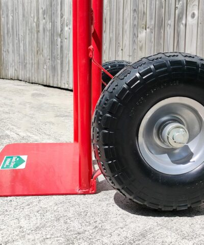 A low angled, side view of the wheels on the p-handle sac truck