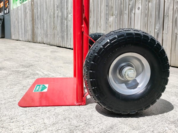 A low angled, side view of the wheels on the p-handle sac truck