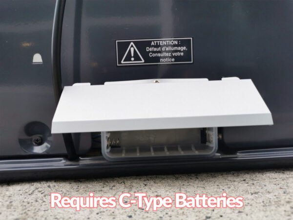 The back of the heater showing the battery insertion location. It's covered by a metallic edge. Overlaid text reads 'Requires C-Type Batteries'