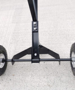 A detail of the black frame, studry screw mount and tyre-axel on the trailer dolly.