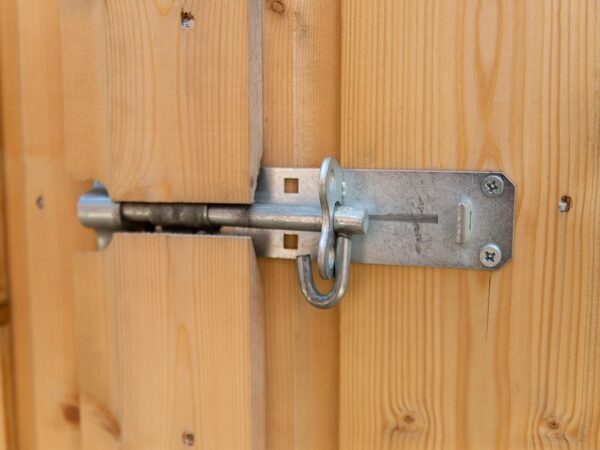 The external lock on the wooden bike store