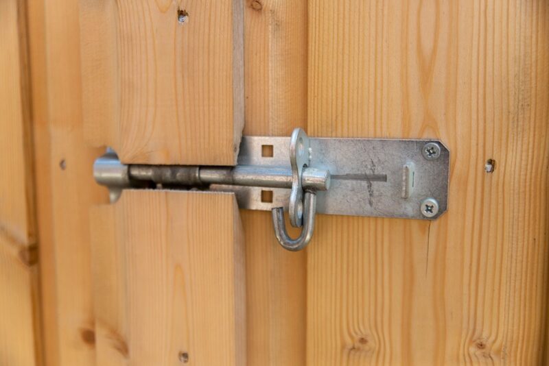 The external lock on the wooden bike store