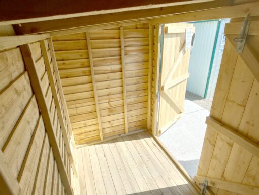 An inside view of the wooden bike shed