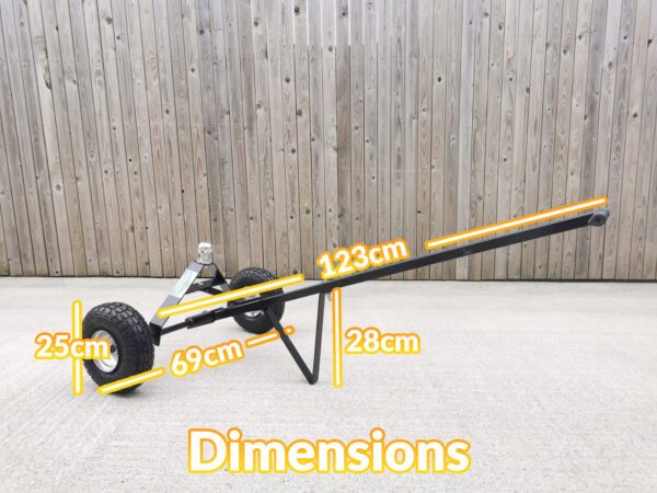 The Trailer Dolly with the Dimensions written on top. It is 123cm long, 69cm wide, the standing support bar is 28cm tall and the wheels are 25cm in diameter