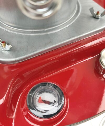 A close look at the fuel cauge and refulling port on the camping stove heater