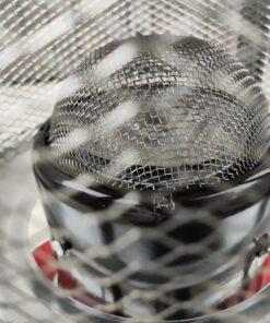 The mesh dome grate on the inside of the camping stove heater