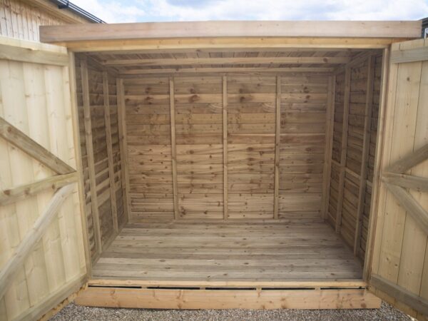 Both doors open on the wooden bike shed
