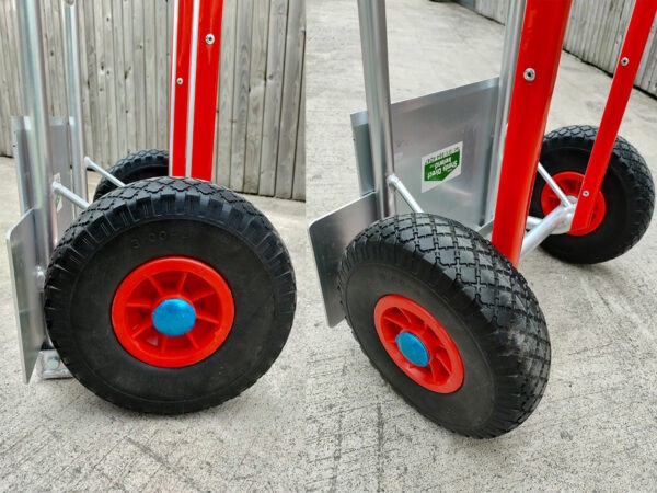 A close up detailed view of the solid wheels on the aluminium hand truck with folding footplate