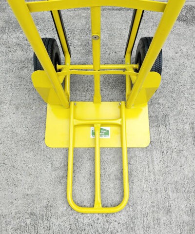 The industrial hand truck with the extension plate in use.