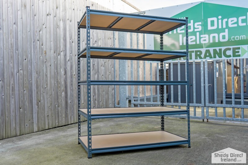 Shelves against a wooden backdrop. There are 5 tiers and the tiers have wooden bases.