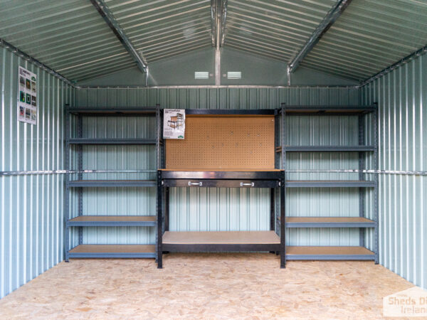 Shelves inside steel shed beside a metal work bench. There are 5 tiers and the tiers have wooden bases.