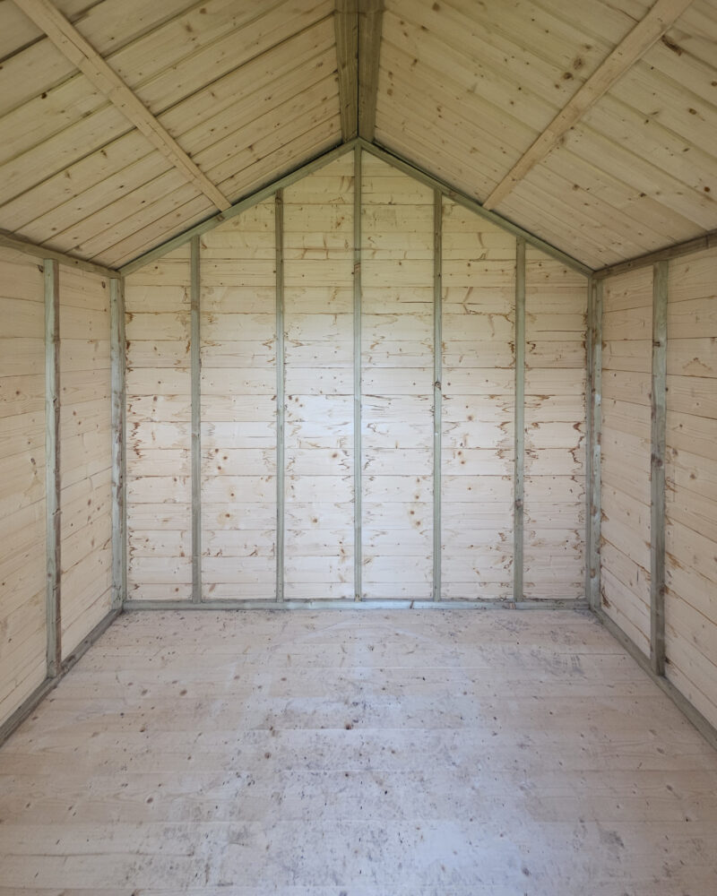 The inside of a wooden lodge shed