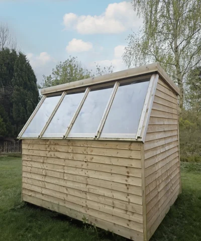 The windows on the wooden potting shed