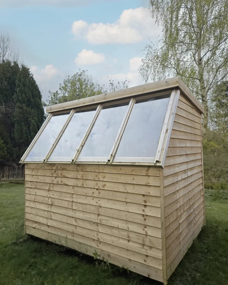 The windows on the wooden potting shed