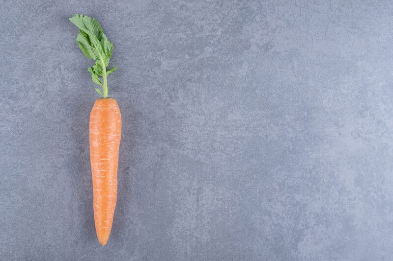 Ripe organic carrots , on the marble background. High quality photo