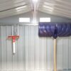 A wide angle picture of the inside of a shed with the focus on two took hooks on the back wall. One is supporting a large, blue snow shovel. The other is supporting a small, red squeegee. The hooks are 30cm long, 10cm wide and they have a picture of a shovel indented into the,