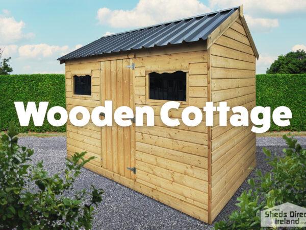 Wooden cottage shed. outside in gravel. light brown in colour.