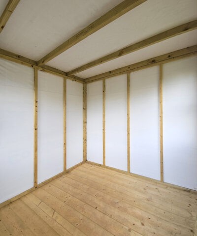 A view of the inside of the corner shed, from the door