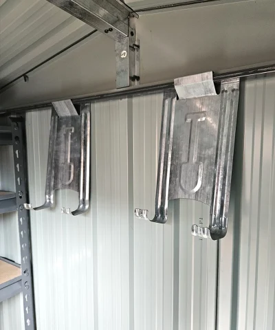 the included tool hooks up on the wall