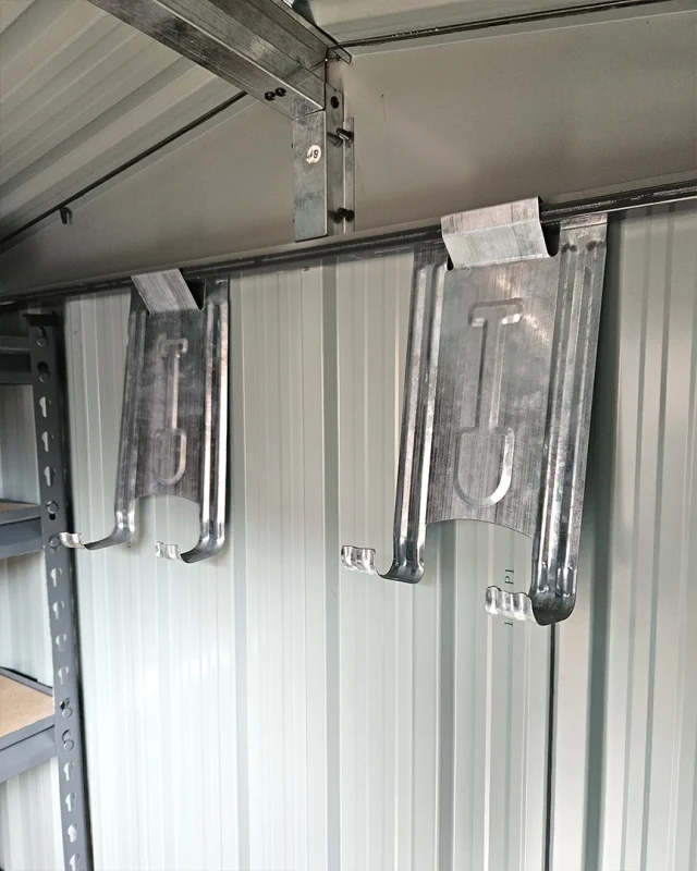 the included tool hooks up on the wall