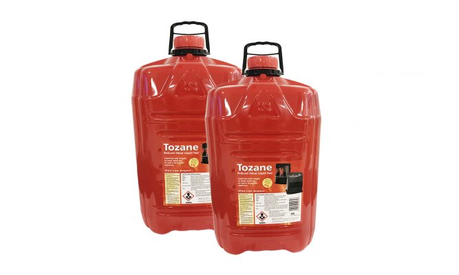 Two bottles of Tozane Fuel standing beside each other. The containers are red and squat, with large black handles