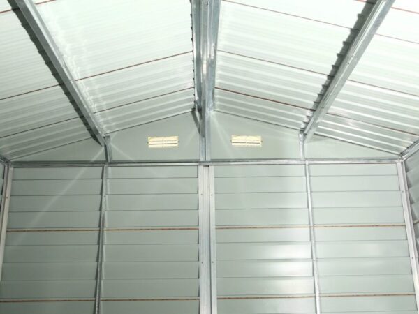 The inside of the Wood Grain Steel Sheds. It is light grey, with five internal vertical structure joists, as well as three roof supports, also in grey.