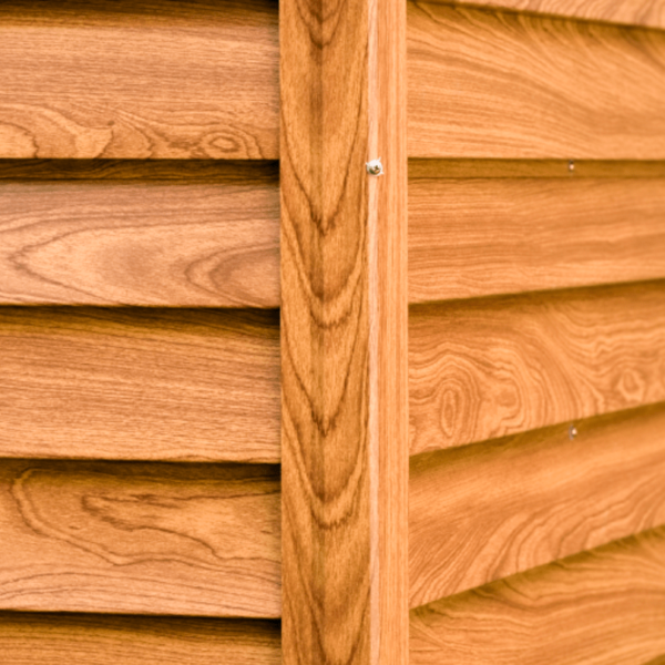 A close up of the panels on a wood grain shed. There's are 6 panels visible which are inset into two sturdier looking panels.