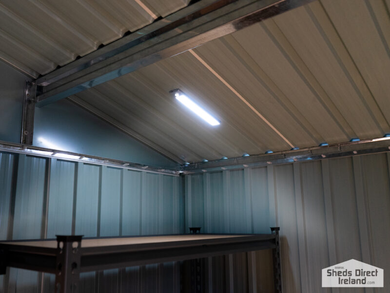 A long, silver LED Light on steel shed