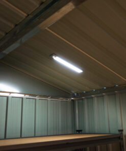 A long, silver LED Light on steel shed