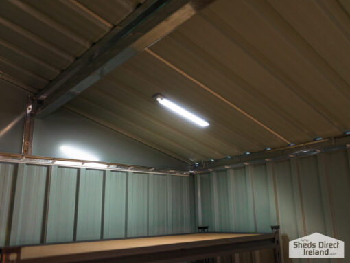 A long, silver LED Light on steel shed
